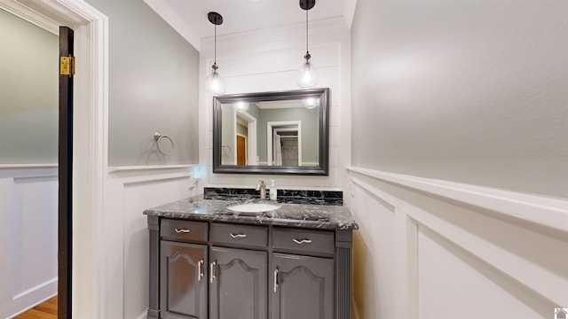 bathroom with hardwood / wood-style floors and vanity