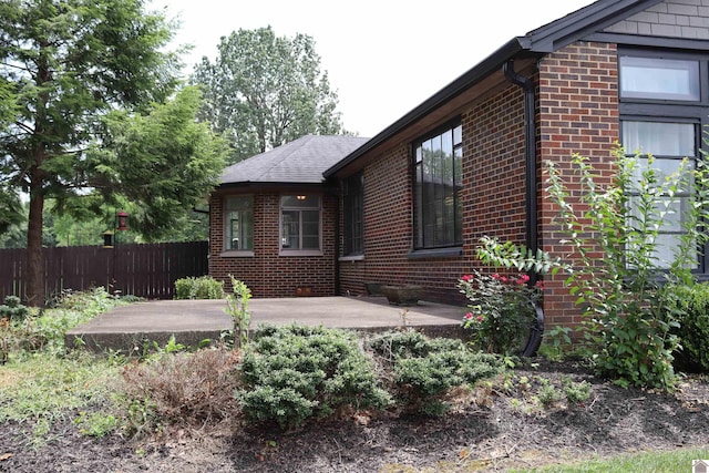 view of side of property with a patio