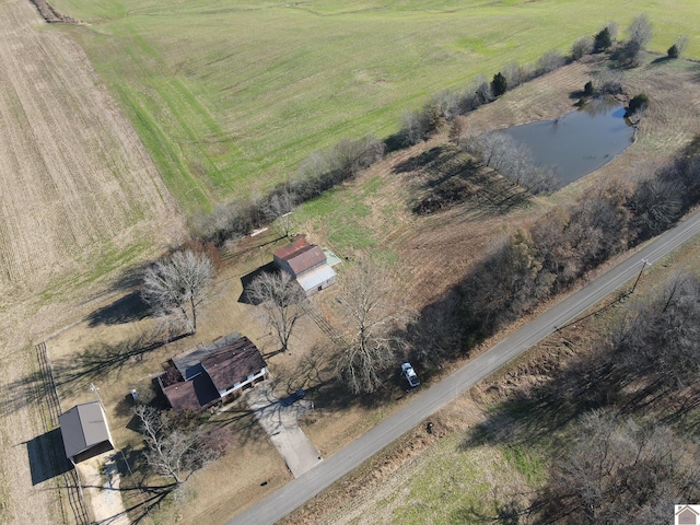 birds eye view of property with a rural view and a water view