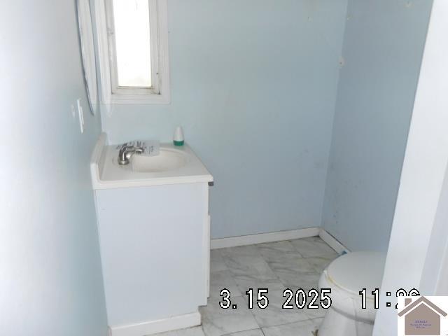 82 Ingleside Rd, Kevil, KY 42053 - half bath featuring vanity and marble finish floors