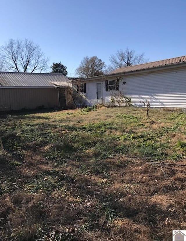 82 Ingleside Rd, Kevil, KY 42053 - rear view of property featuring a metal roof