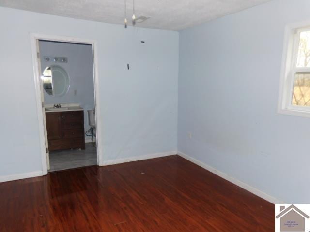 82 Ingleside Rd, Kevil, KY 42053 - unfurnished room featuring baseboards and wood finished floors