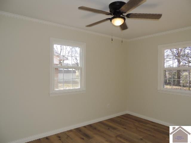 spare room with crown molding, plenty of natural light, dark wood-type flooring, and ceiling fan