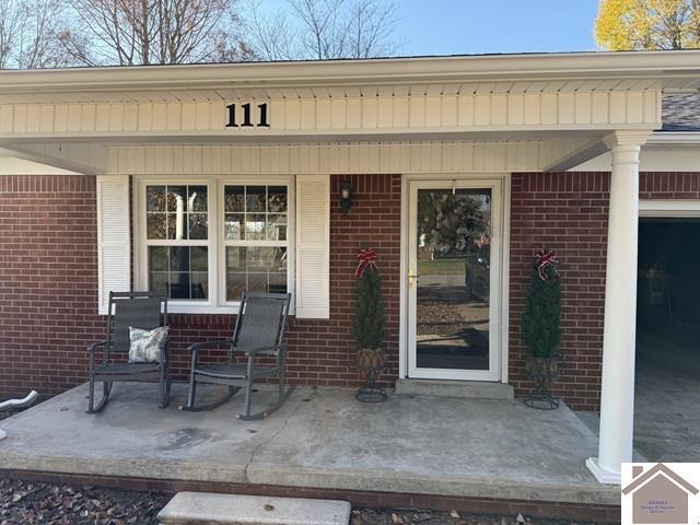 doorway to property with covered porch