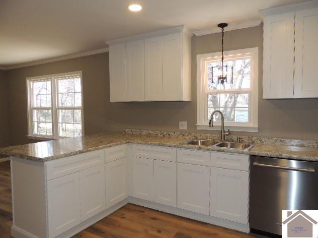 kitchen featuring stainless steel dishwasher, plenty of natural light, kitchen peninsula, and sink