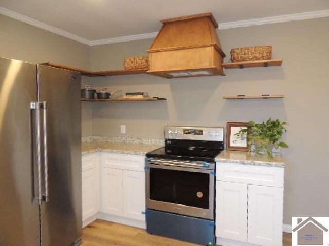 kitchen with custom exhaust hood, crown molding, appliances with stainless steel finishes, light hardwood / wood-style floors, and white cabinetry