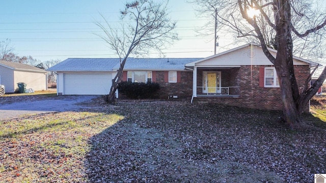 single story home featuring a garage