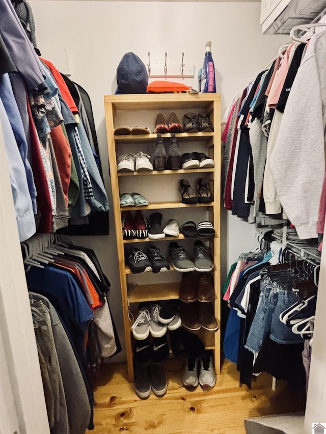 spacious closet featuring hardwood / wood-style floors