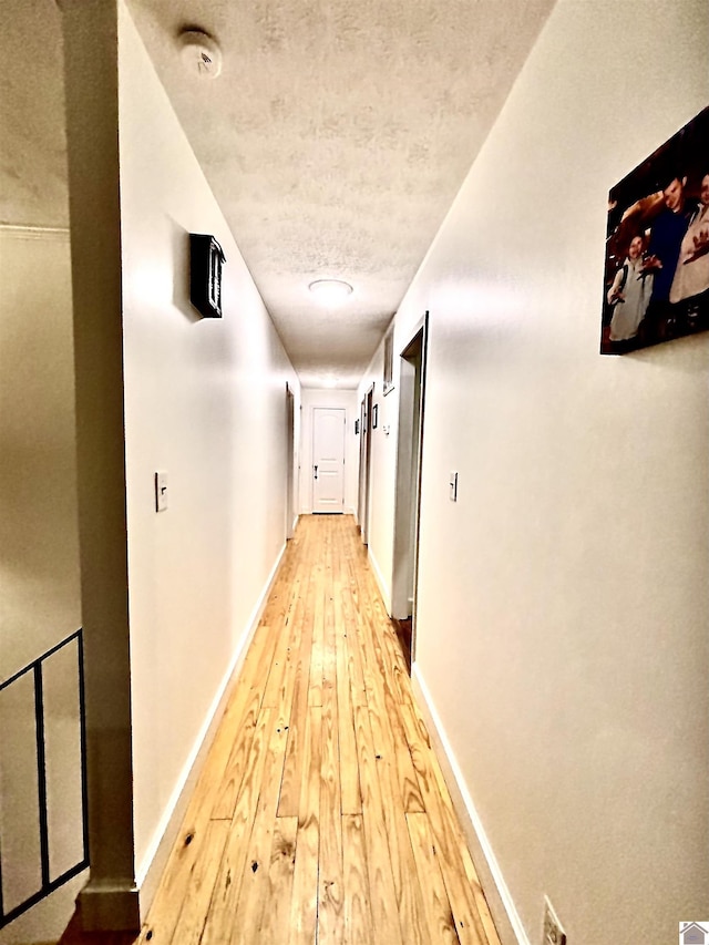 hallway featuring wood-type flooring