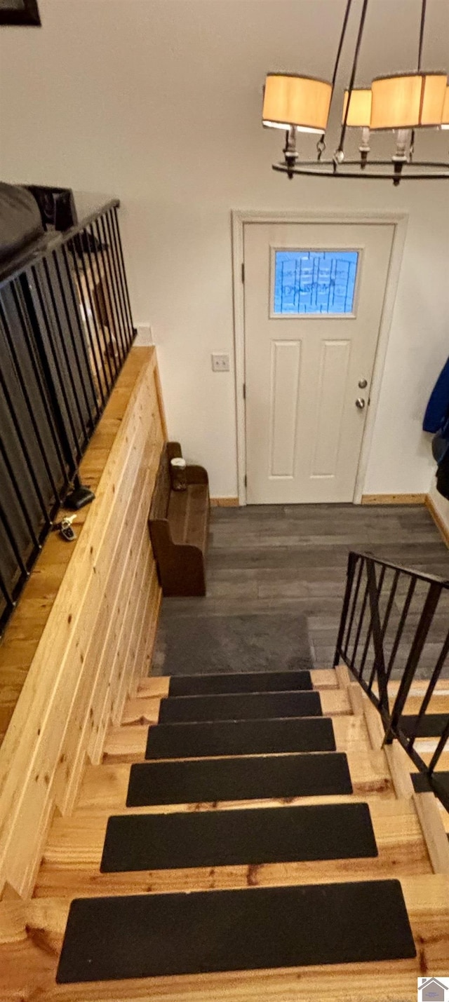 stairway featuring hardwood / wood-style flooring