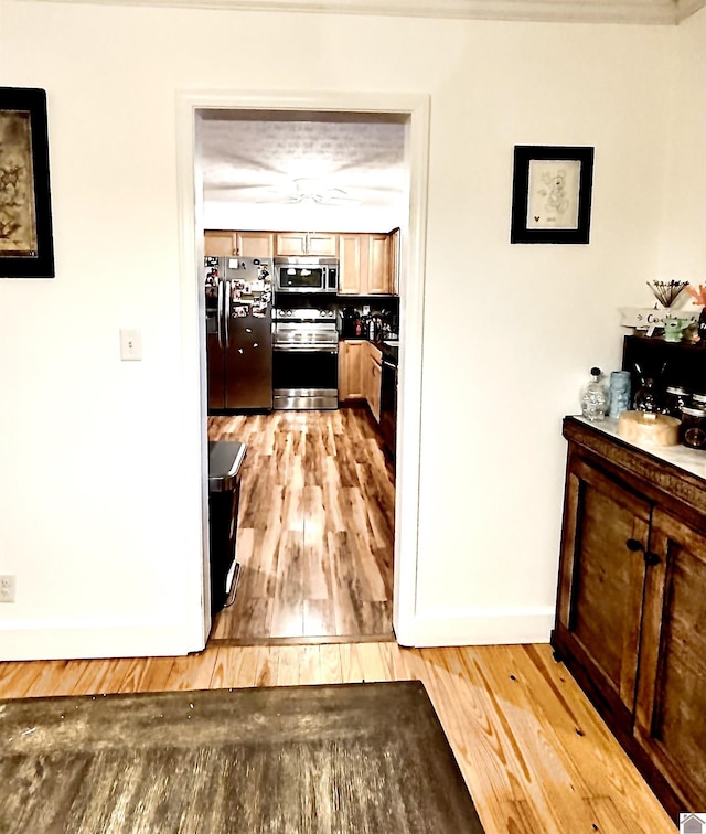 corridor featuring light hardwood / wood-style flooring