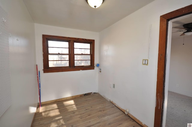 spare room with ceiling fan and light hardwood / wood-style flooring