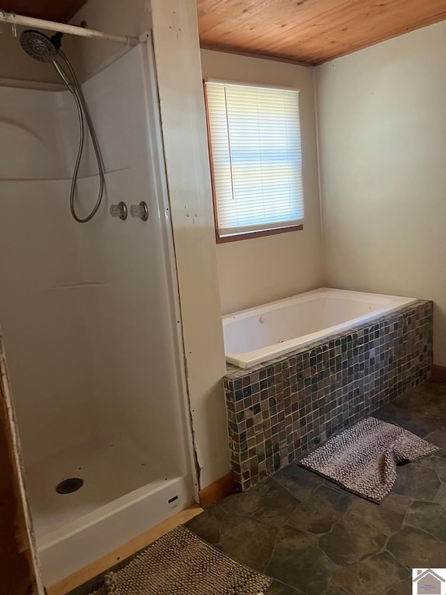 bathroom featuring a shower and wood ceiling