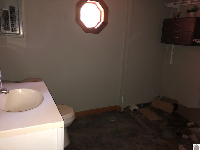 51 Yawe, New Concord, KY 42076 - bathroom featuring vanity, toilet, and baseboards