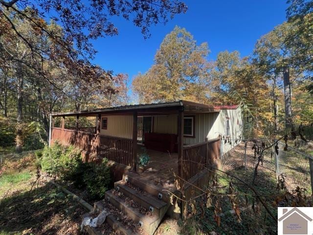 back of house featuring a deck