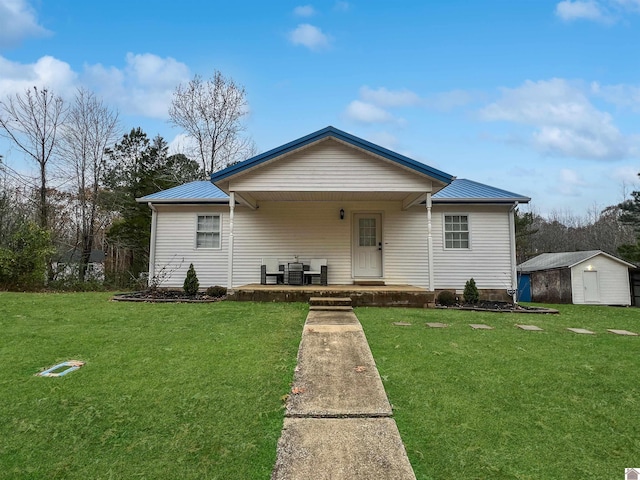 view of front of home featuring central AC, a shed, a front lawn, and a porch