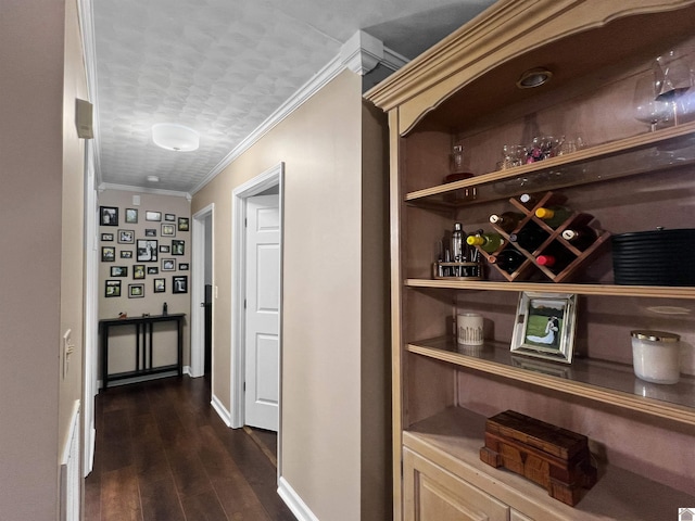 bar featuring dark hardwood / wood-style flooring and crown molding