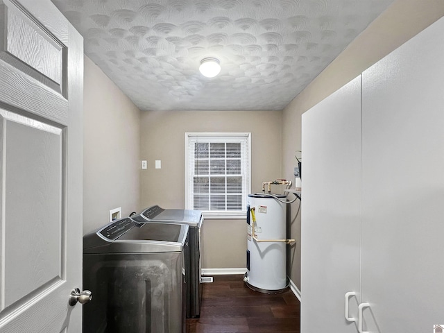 clothes washing area featuring a textured ceiling, water heater, dark hardwood / wood-style floors, and independent washer and dryer