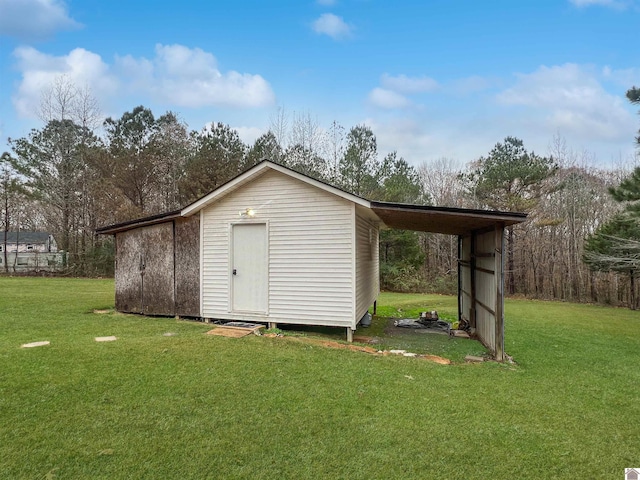 view of outbuilding with a lawn