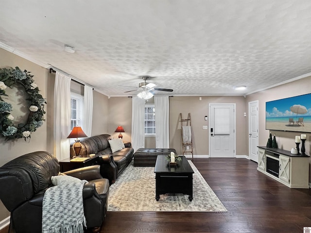 living room featuring a textured ceiling, crown molding, ceiling fan, and dark wood-type flooring