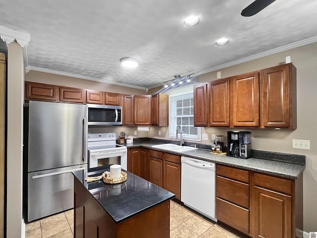 kitchen with sink, light tile patterned floors, stainless steel appliances, and ornamental molding