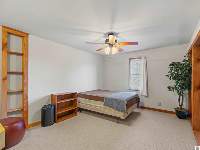 bedroom featuring light carpet and ceiling fan