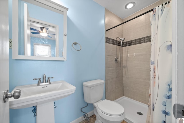 bathroom with a shower with curtain and toilet