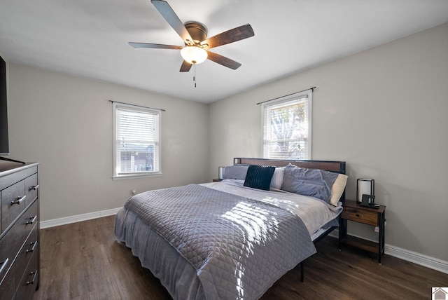 bedroom with dark hardwood / wood-style floors and ceiling fan