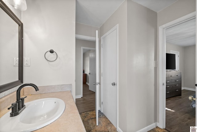 bathroom with vanity and wood-type flooring