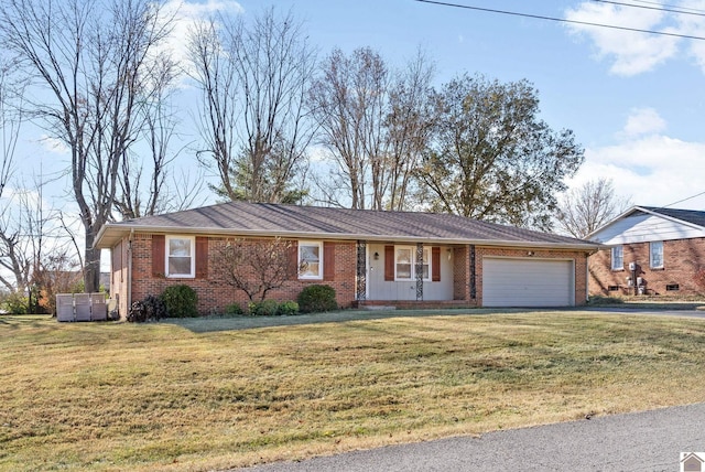 ranch-style home with a garage and a front yard