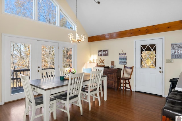 dining space with dark hardwood / wood-style flooring, high vaulted ceiling, and a notable chandelier