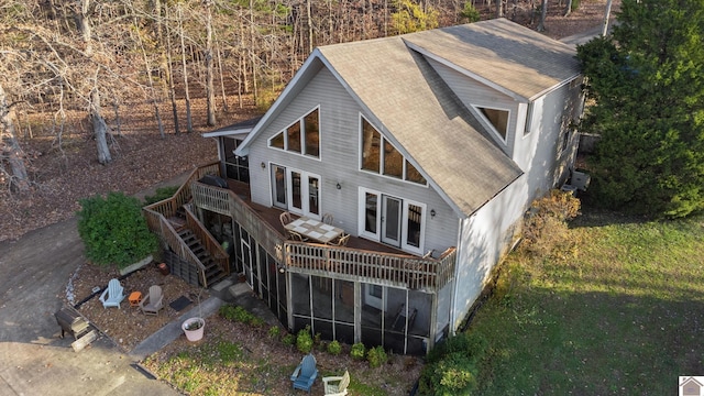 back of house with a yard, a wooden deck, and french doors