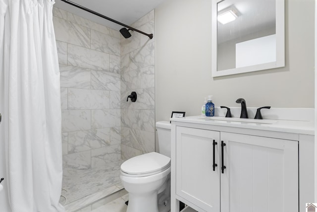 bathroom featuring a shower with curtain, toilet, and vanity