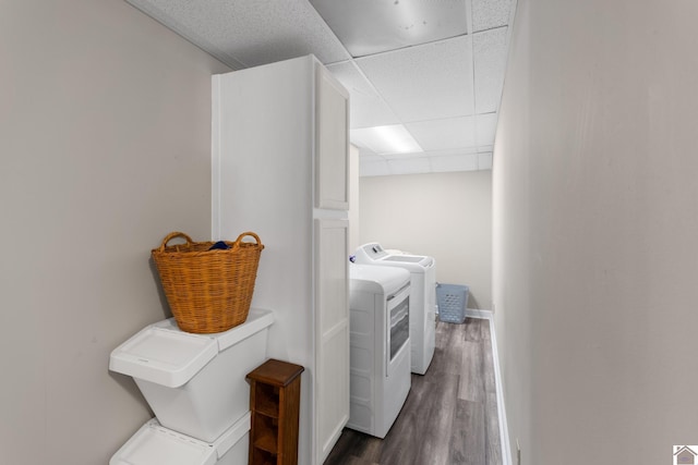 washroom featuring washer and clothes dryer and dark wood-type flooring