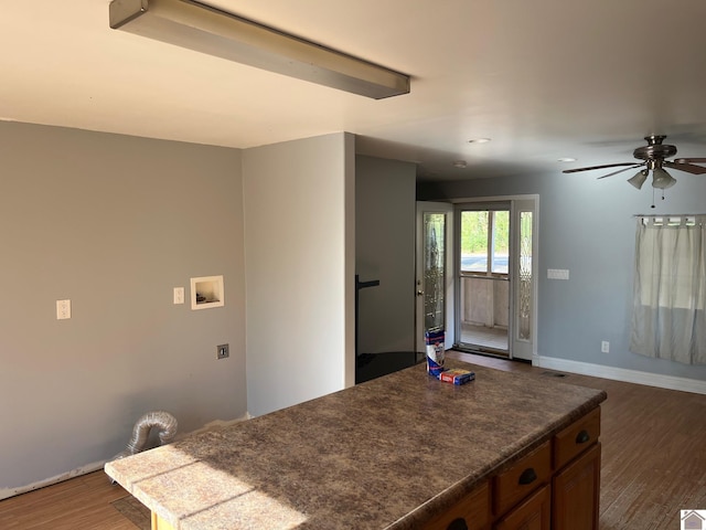 kitchen featuring ceiling fan and dark hardwood / wood-style flooring