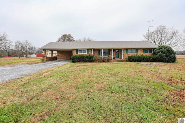 ranch-style home with a front yard and a carport