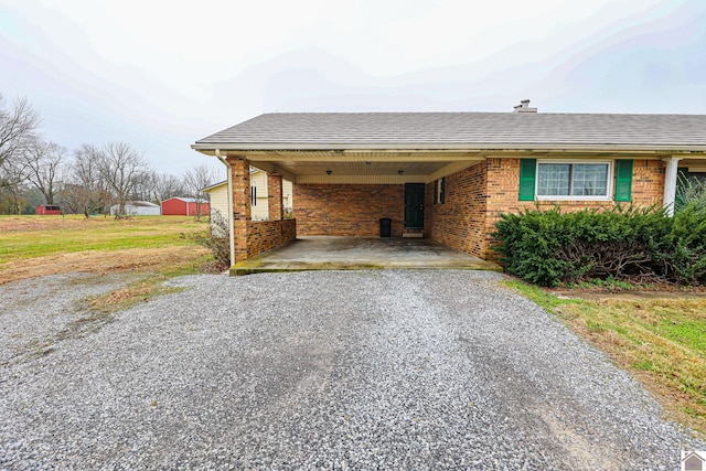 ranch-style house featuring a carport