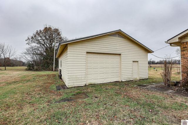 garage with a lawn