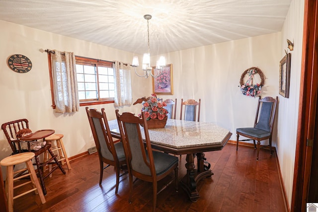 dining space featuring a chandelier and dark wood-type flooring