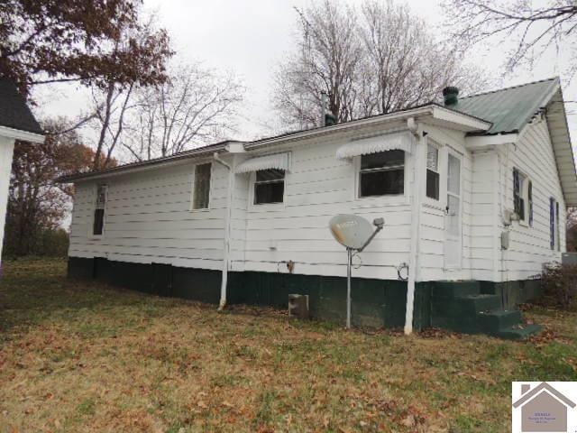 back of house with a yard