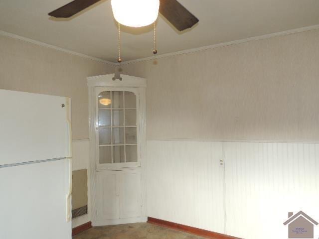 unfurnished dining area featuring ornamental molding