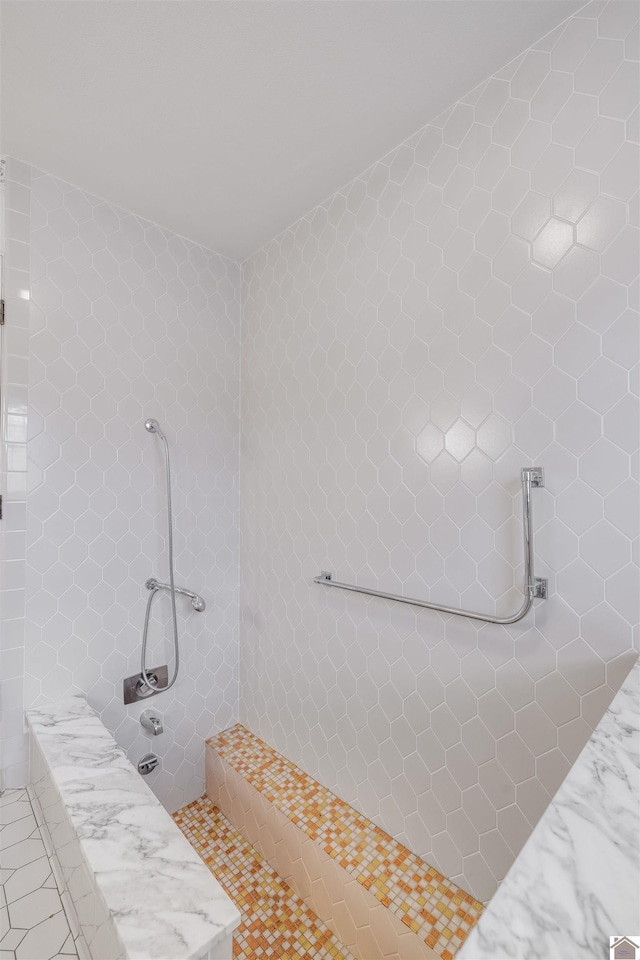 bathroom with tiled shower