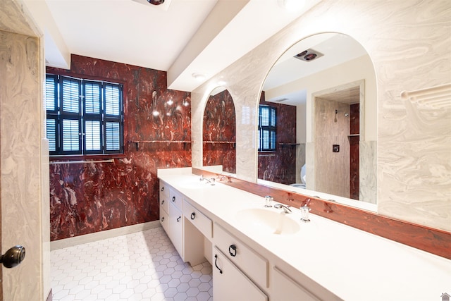 bathroom with tile patterned flooring and vanity