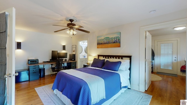 bedroom with hardwood / wood-style floors, french doors, and ceiling fan