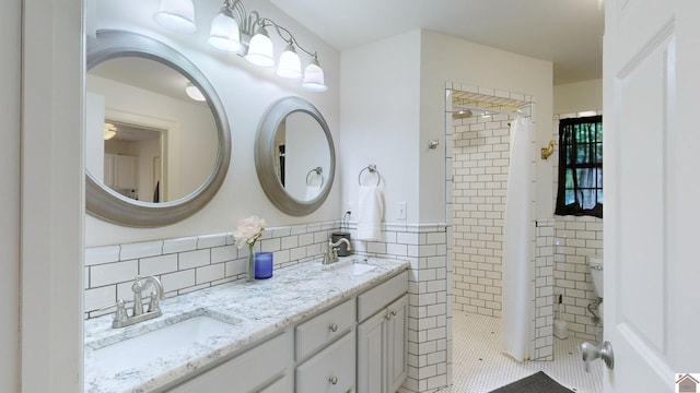 bathroom featuring vanity, tile walls, and tiled shower