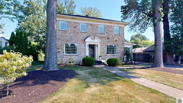 colonial-style house with a front lawn