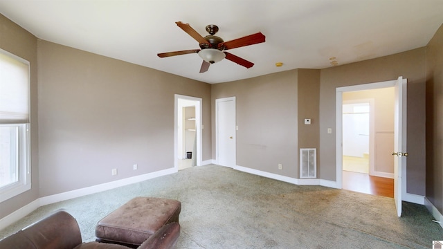 interior space featuring ceiling fan