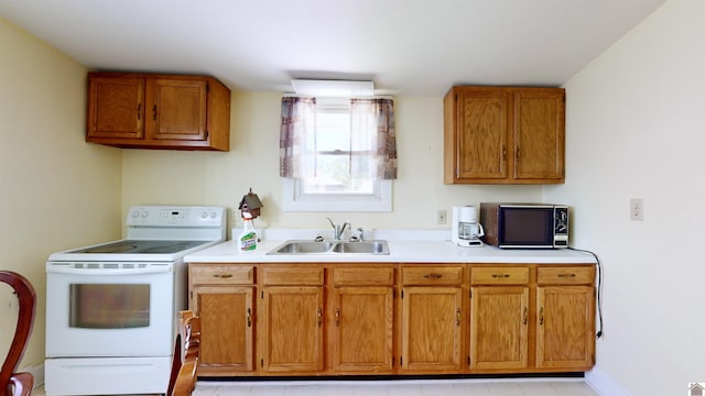 kitchen with electric range and sink