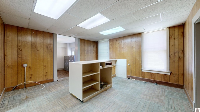 spare room featuring wood walls