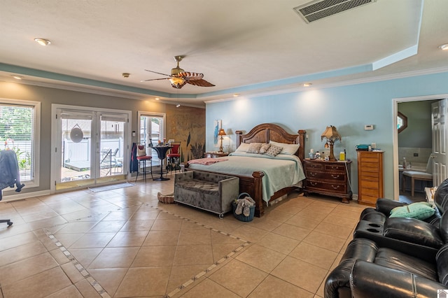 tiled bedroom featuring ceiling fan, crown molding, access to outside, and a tray ceiling